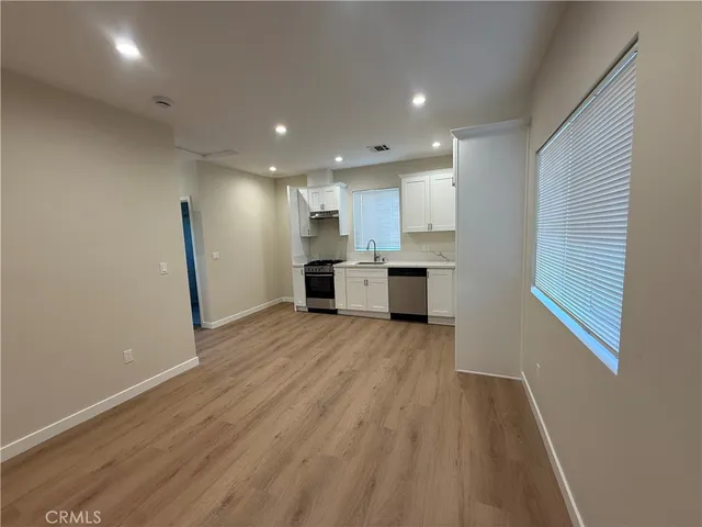 a view of kitchen with wooden floor