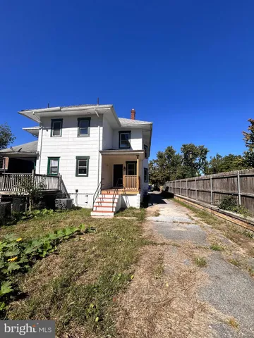 a house with trees in the background