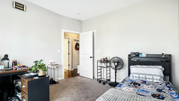 a bedroom with furniture and a window