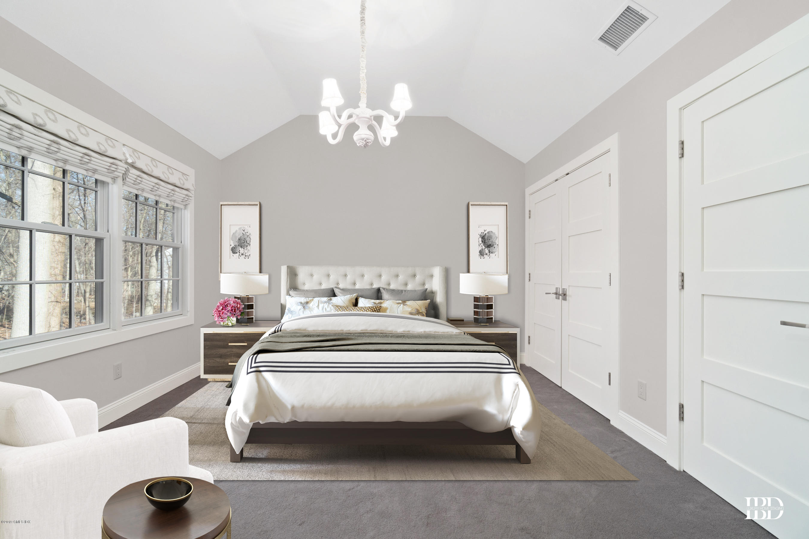 340 Valley Road, Unit 5 Cos Cob, CT 06807 - Photo 14 of 29 a spacious bedroom with a bed and a chandelier