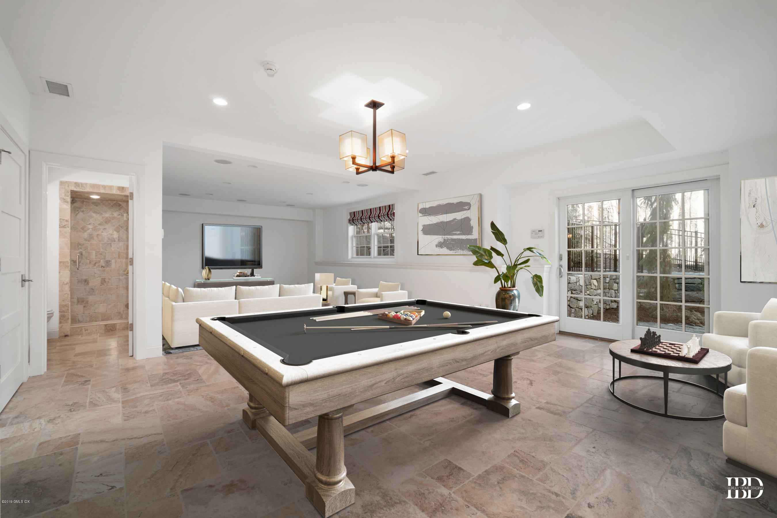 340 Valley Road, Unit 5 Cos Cob, CT 06807 - Photo 16 of 29 a living room with furniture a rug and a chandelier