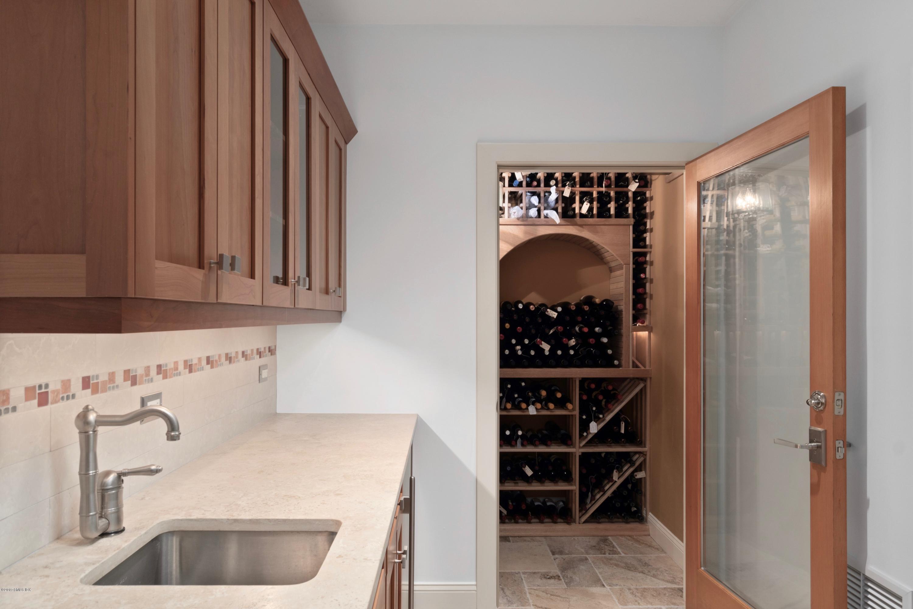 340 Valley Road, Unit 5 Cos Cob, CT 06807 - Photo 17 of 29 a bathroom with a sink and a mirror