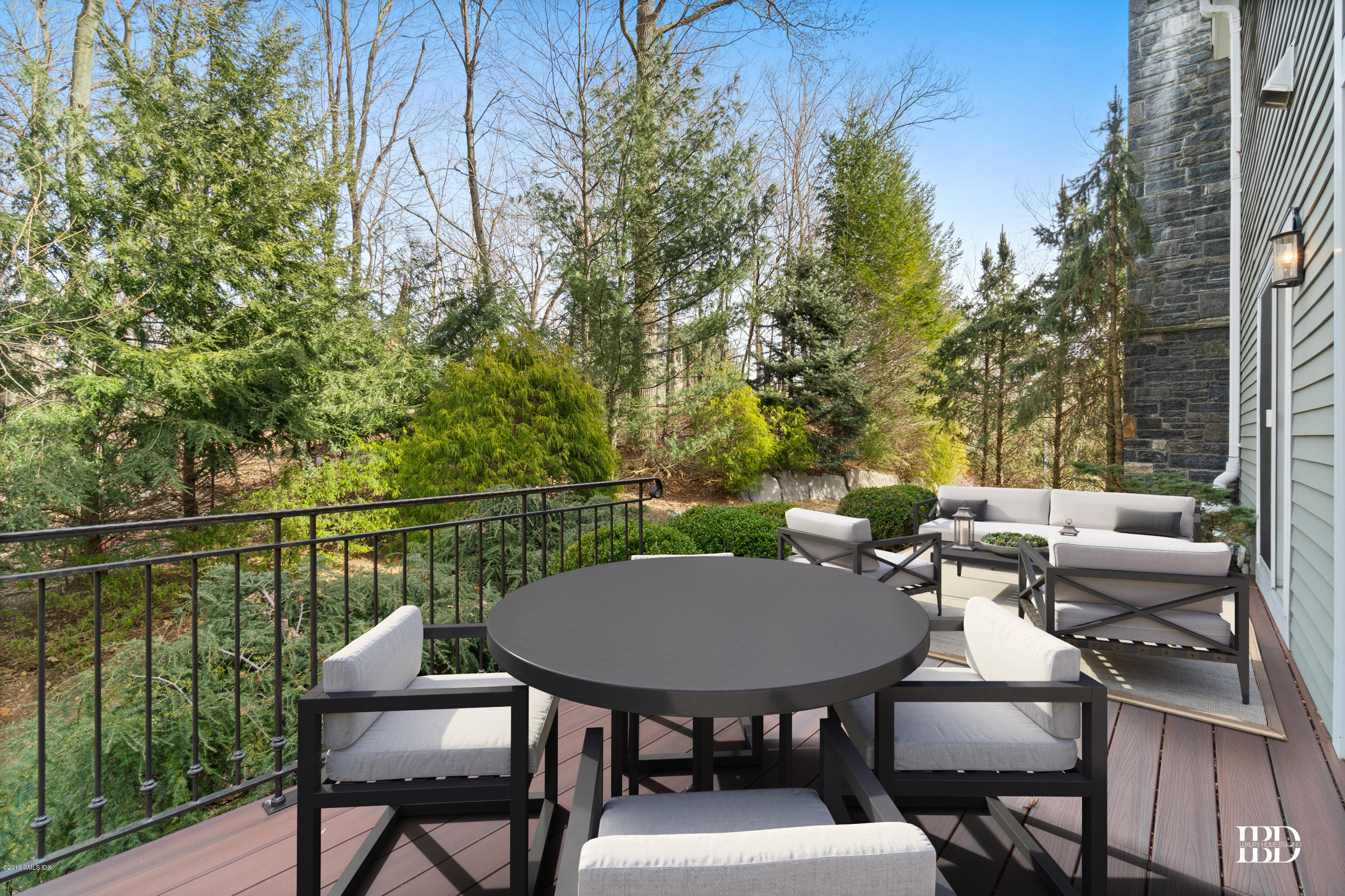 340 Valley Road, Unit 5 Cos Cob, CT 06807 - Photo 20 of 29 a balcony with a table and chairs