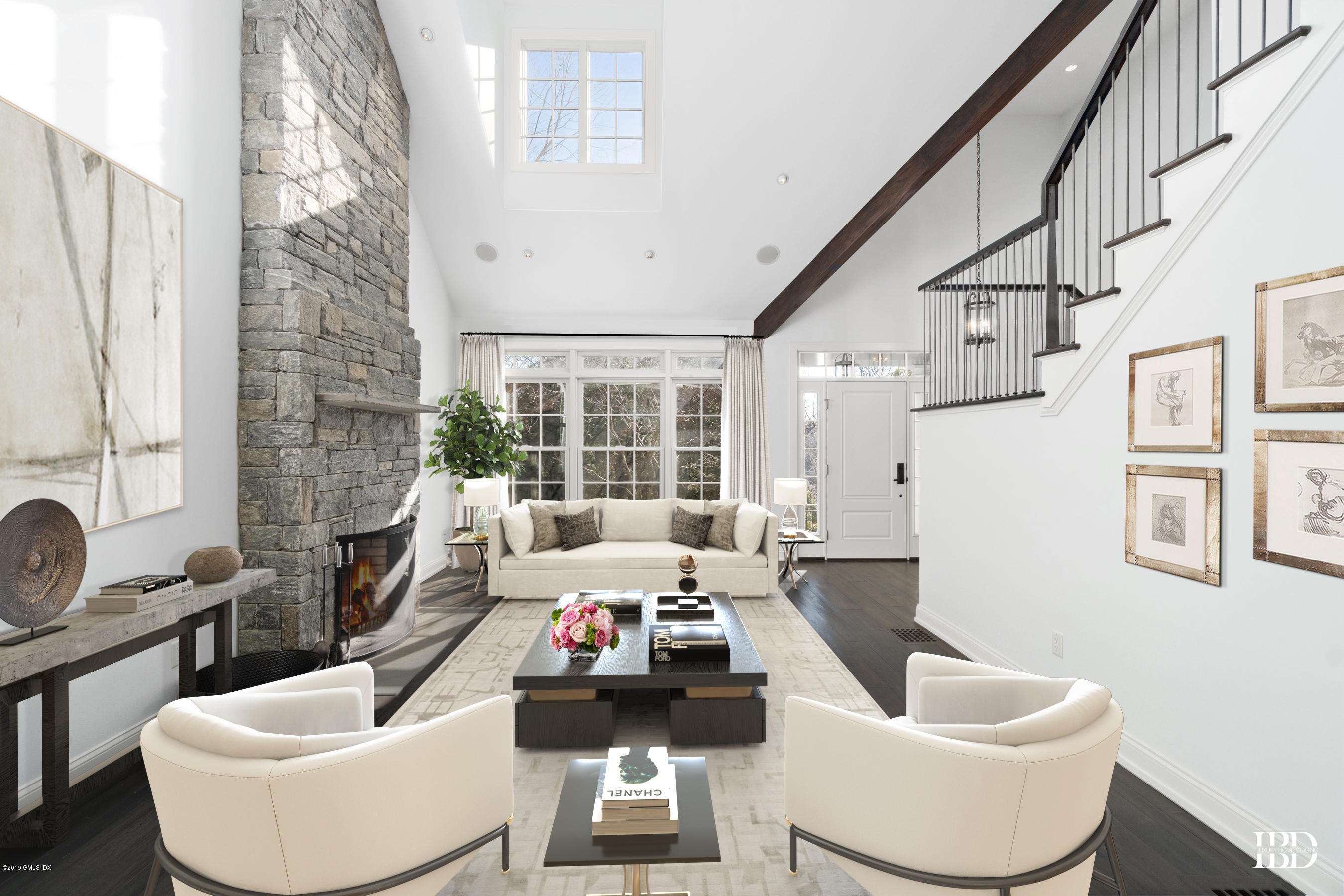 340 Valley Road, Unit 5 Cos Cob, CT 06807 - Photo 4 of 29 a living room with furniture and a large window