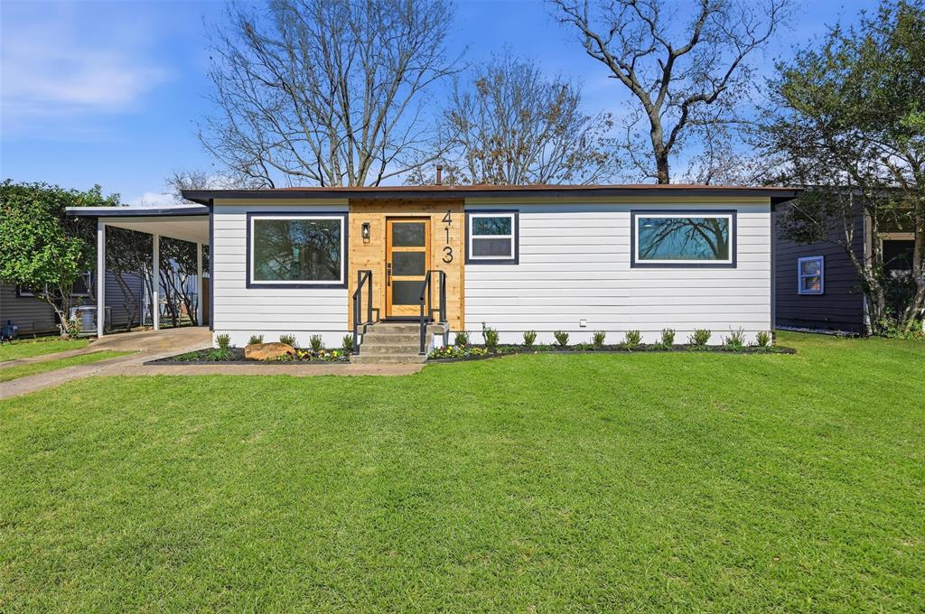 a view of a house with a back yard