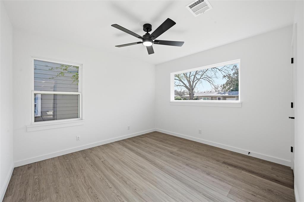 413 Wanda Way Hurst, TX 76053 - Photo 15 of 26 a view of empty room with wooden floor and window