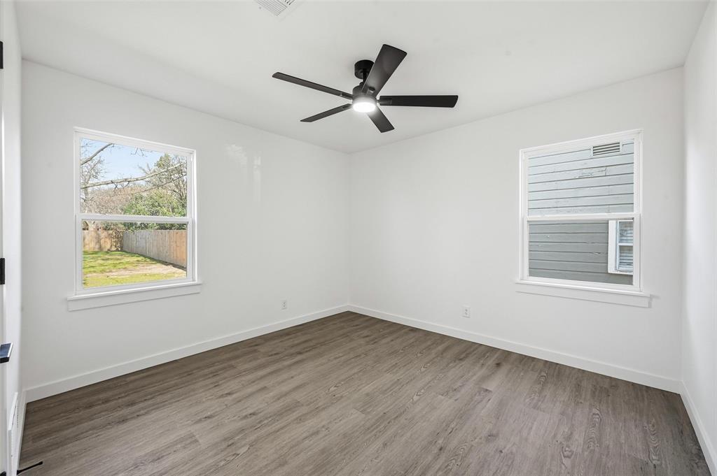 413 Wanda Way Hurst, TX 76053 - Photo 18 of 26 a view of empty room with wooden floor and fan