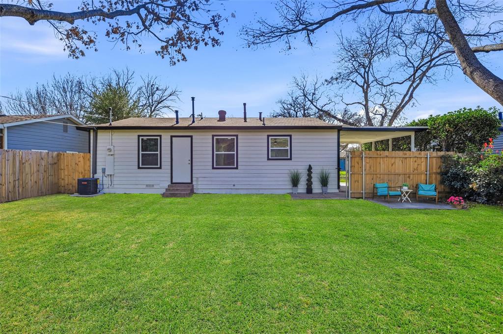 413 Wanda Way Hurst, TX 76053 - Photo 21 of 26 a front view of a house with garden