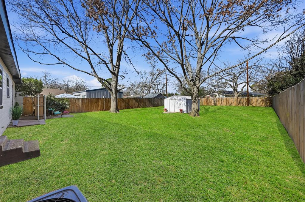413 Wanda Way Hurst, TX 76053 - Photo 22 of 26 a view of a house with a yard