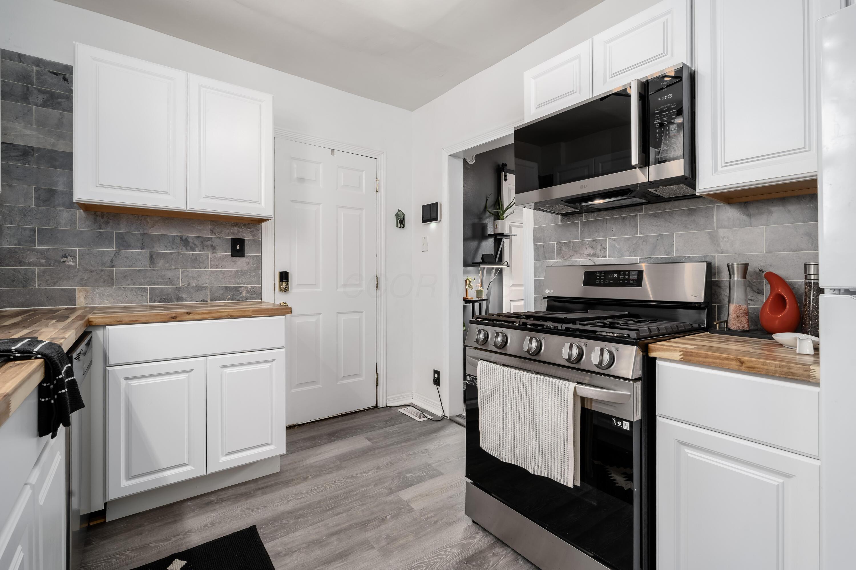 1581 East Weber Road Columbus, OH 43211 - Photo 19 of 41 Clean white cabinets...