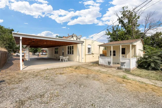 a view of a car park in front of house