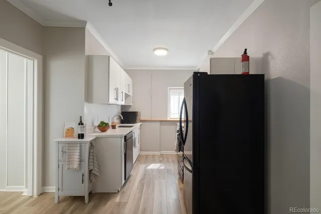 a kitchen with stainless steel appliances a refrigerator and a refrigerator