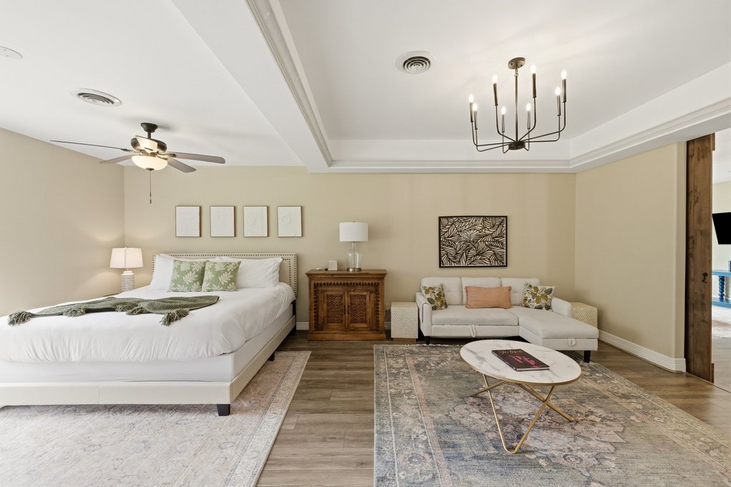 12135 Fitzhugh Road Austin, TX 78736 - Photo 6 of 30 a living room with furniture and a chandelier