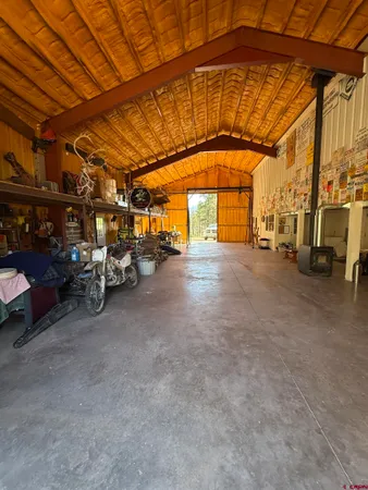 a view of garage with cars