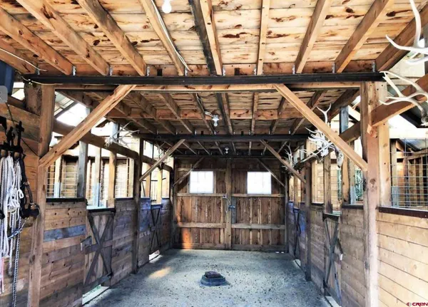 a view of porch with a wooden fence