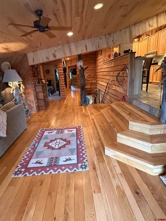 a view of a studio with wooden floor