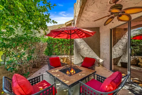 outdoor space with lots of furniture and umbrella