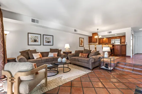a living room with furniture and a table