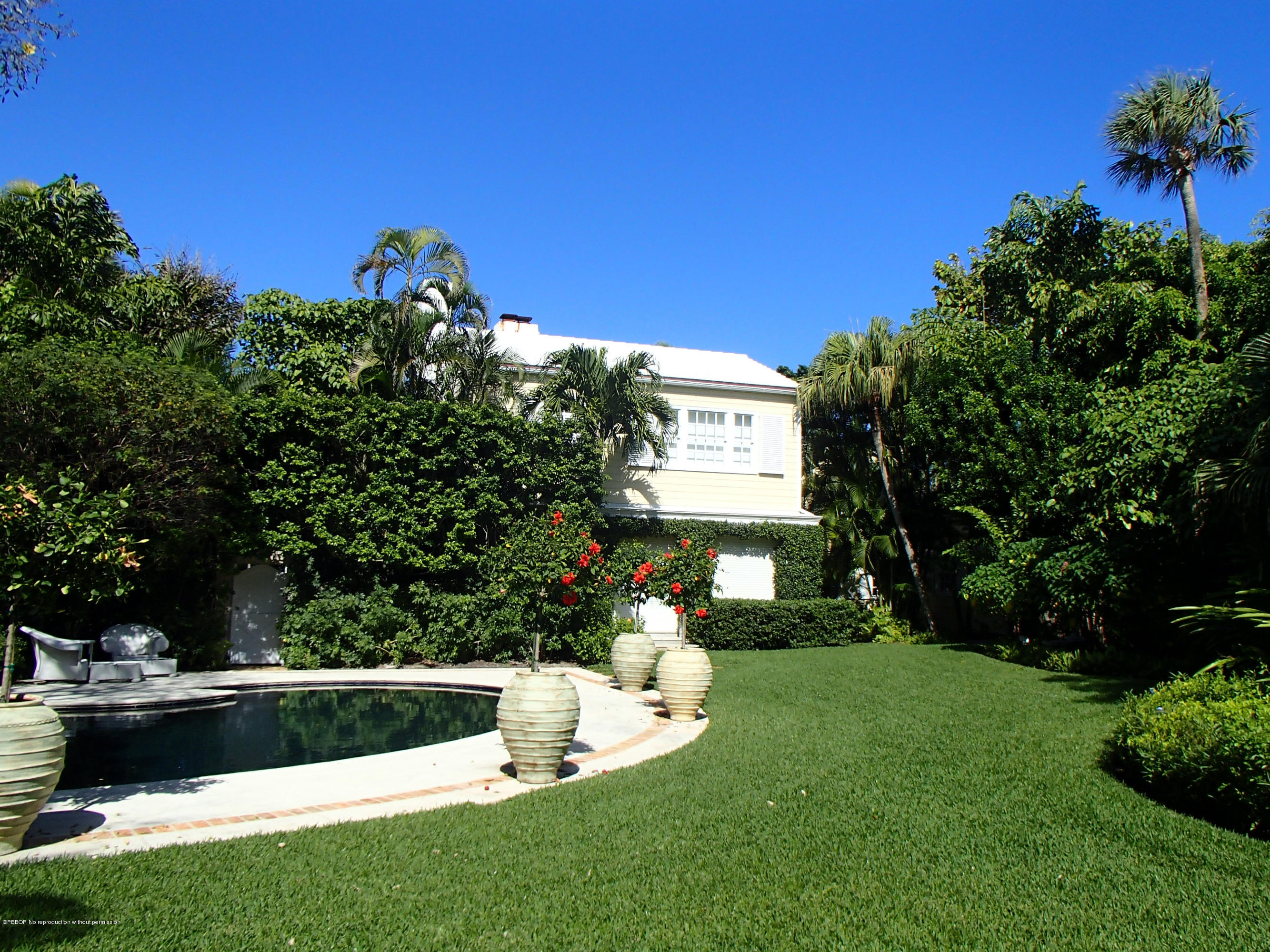 535 South County Road Palm Beach, FL 33480 - Photo 3 of 9 a view of a house with a yard potted plants and a palm tree