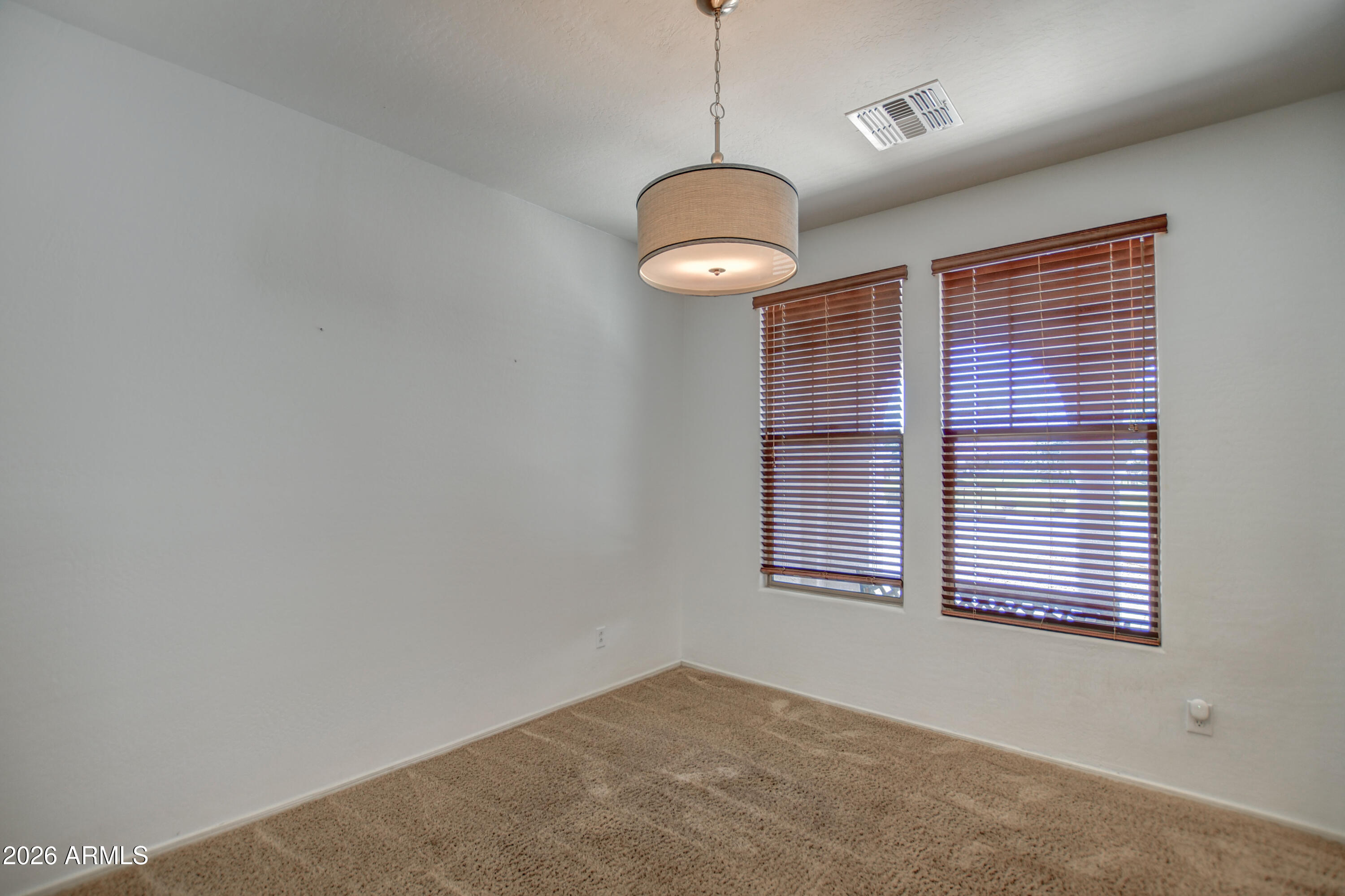 3078 East Muirfield Street Gilbert, AZ 85298 - Photo 17 of 92 a view of a room with a ceiling fan and window