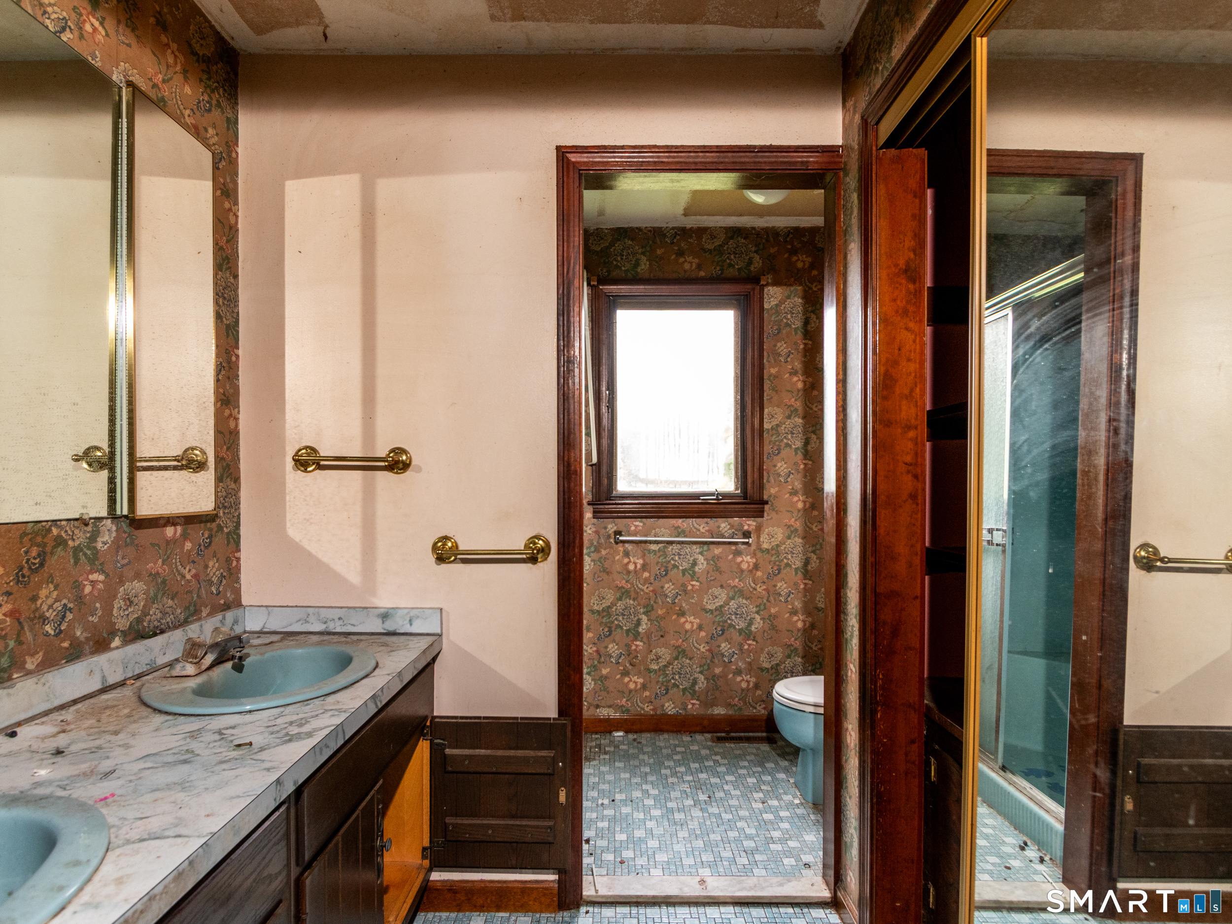63 High Hill Road Wallingford, CT 06492 - Photo 24 of 34 a bathroom with a granite countertop sink and a mirror