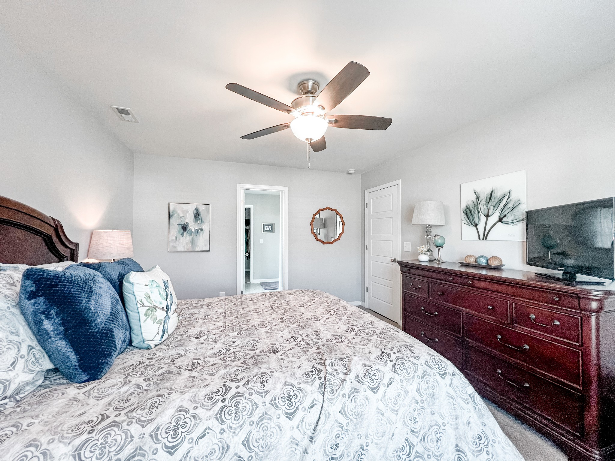 509 Skipping Stone Road Christiana, TN 37037 - Photo 13 of 33 a bedroom with a bed and a chandelier
