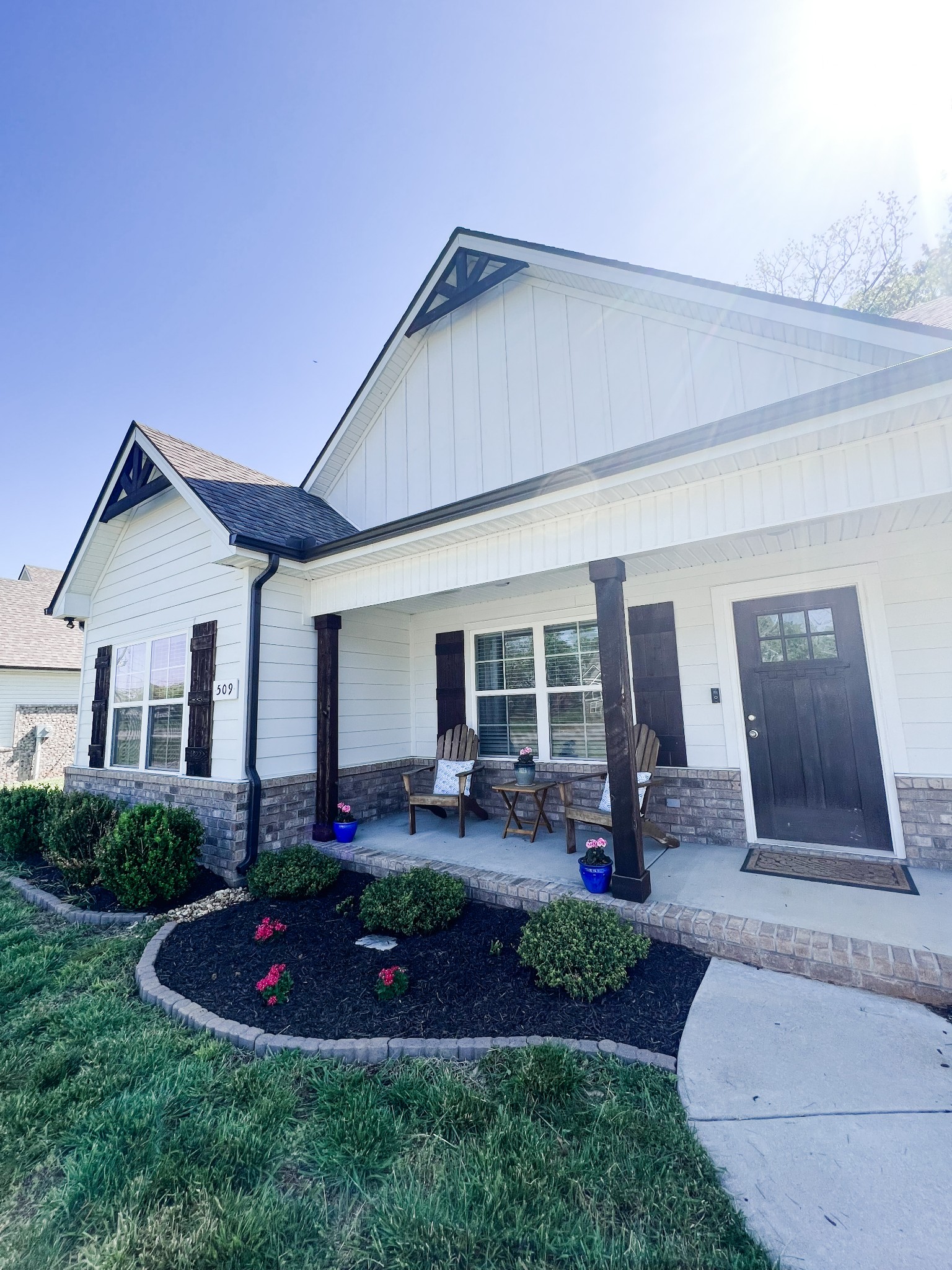 509 Skipping Stone Road Christiana, TN 37037 - Photo 32 of 33 a front view of house with a garden and patio
