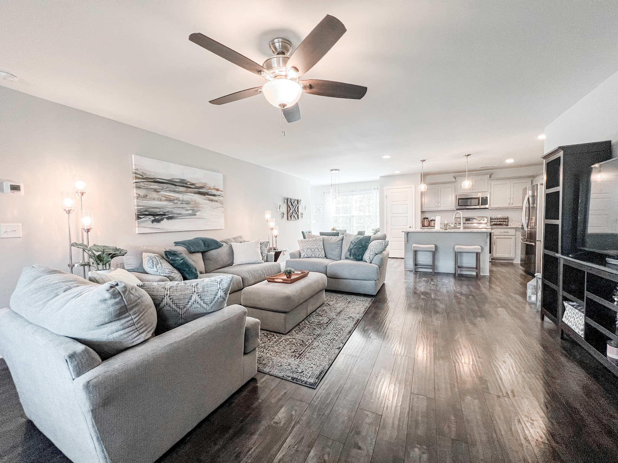 509 Skipping Stone Road Christiana, TN 37037 - Photo 6 of 33 a living room with furniture kitchen view and a wooden floor