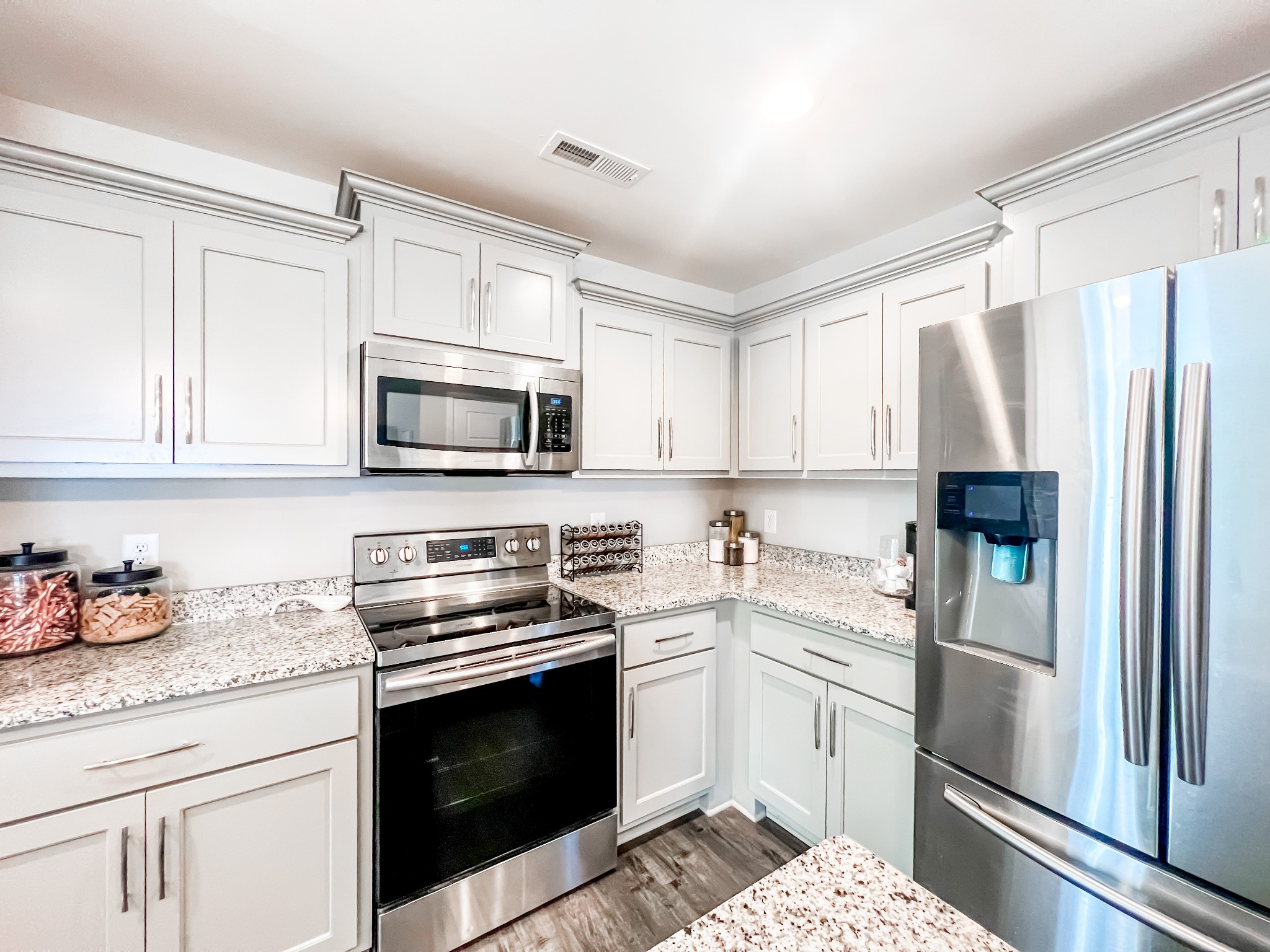 509 Skipping Stone Road Christiana, TN 37037 - Photo 10 of 33 a kitchen with white cabinets and appliances