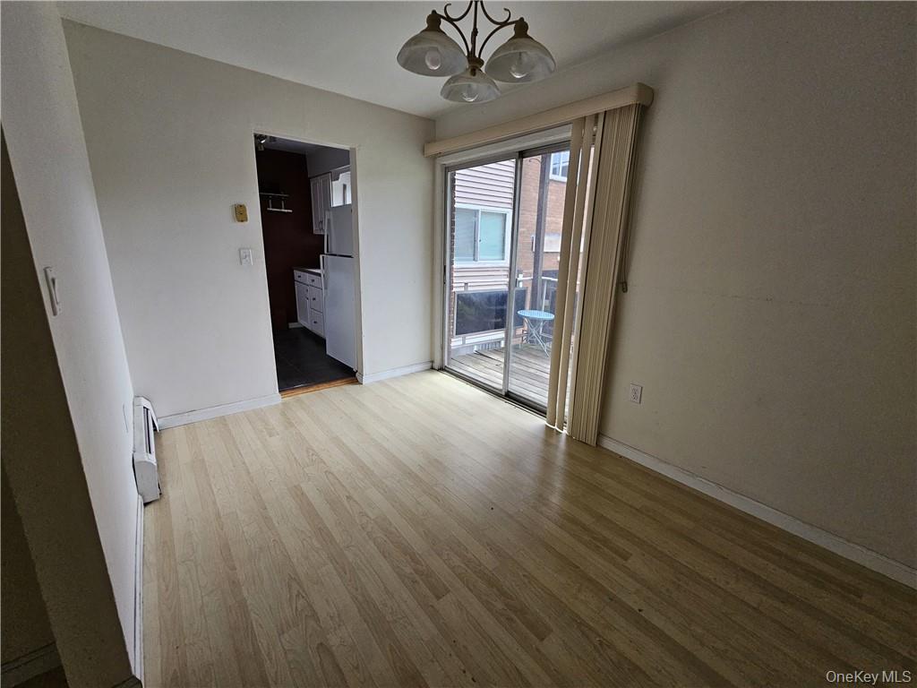 17 Tanager Road, Unit 1704 Monroe, NY 10950 - Photo 3 of 10 wooden floor in an empty room with a window