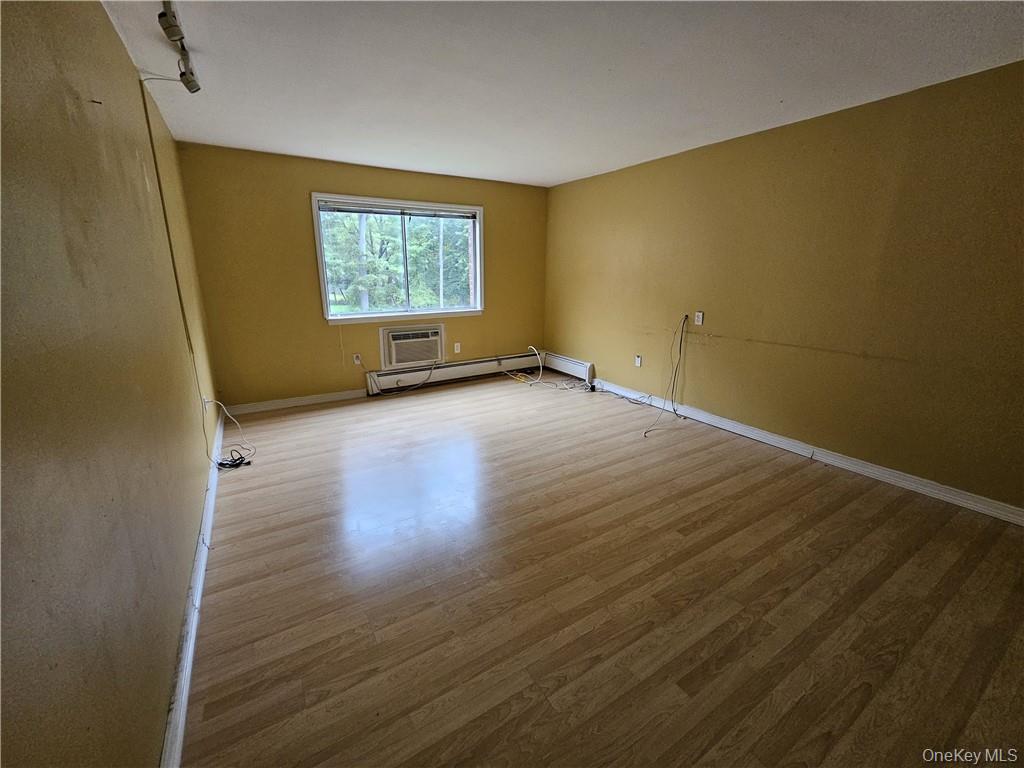 17 Tanager Road, Unit 1704 Monroe, NY 10950 - Photo 6 of 10 a view of a room with wooden floor and window