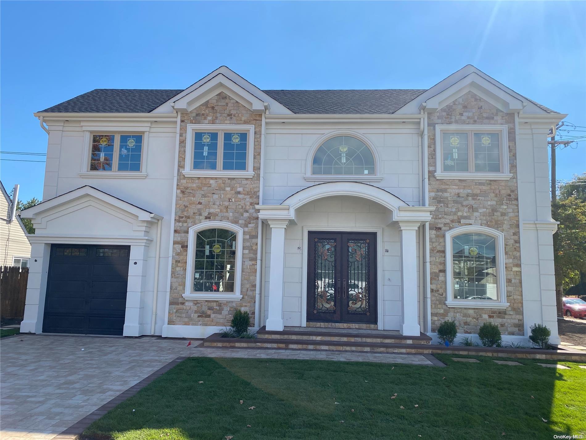 130 Spindle Road Hicksville, NY 11801 - Photo 1 of 1 a front view of a house with a yard
