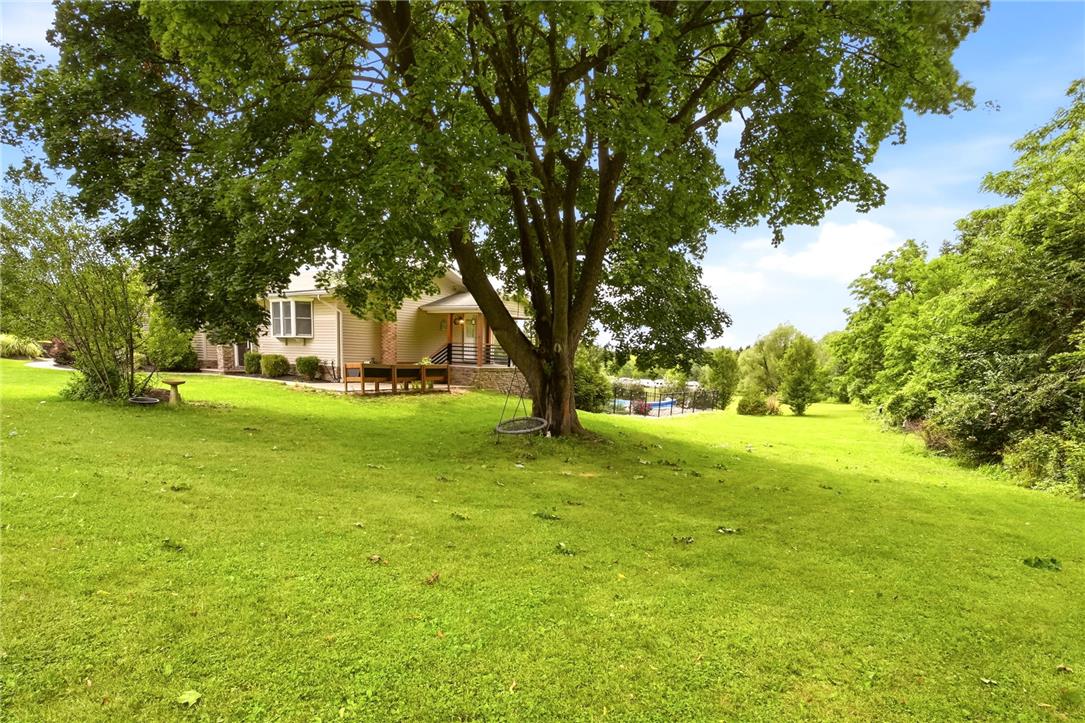 463 North Penn Dixie Road Bath, PA 18014 - Photo 73 of 86 A spacious yard with mature trees offers a serene natural setting and a distant pool.