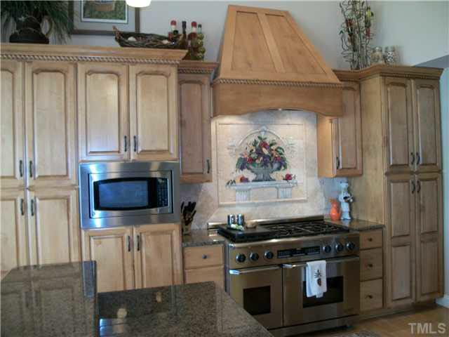 1318 Covington Road Semora, NC 27343 - Photo 4 of 25 Beautiful custom maple cabinetry, tile back splash, wine cooler too.