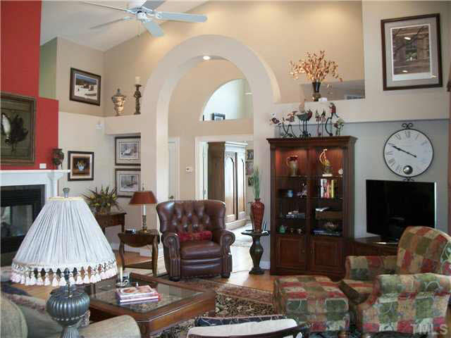 1318 Covington Road Semora, NC 27343 - Photo 7 of 25 Great Room is located in the central part of the house with expansive glass and vaulted ceilings creating the feeling of being "outdoors". The fireplace is a "see-through" for the Family Room as well as the adjoining Living Room/Sitting Room area.