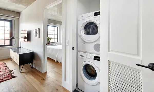 a bathroom with a sink toilet vanity and shower