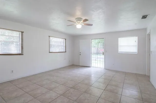 a view of an empty room with a window