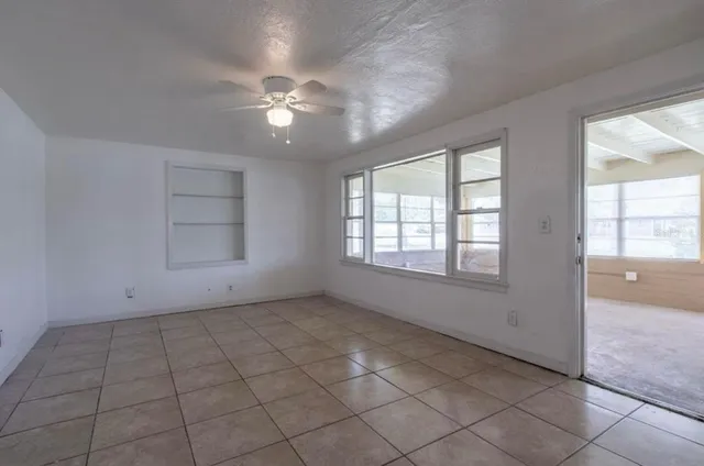 a view of an empty room with a window