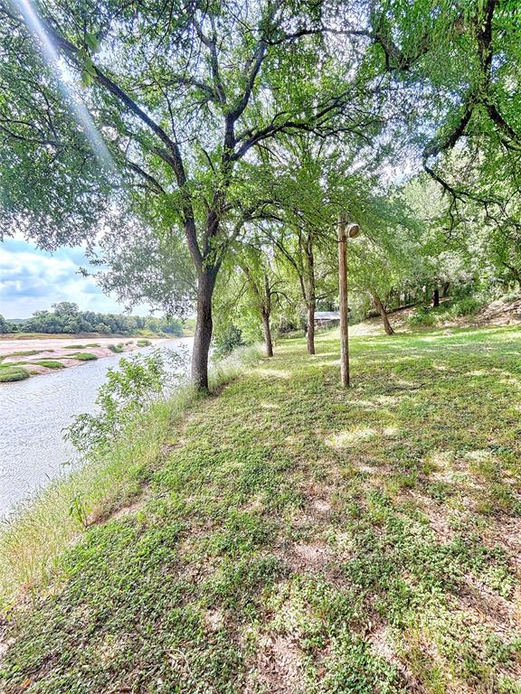 101 Riverview Road Millsap, TX 76066 - Photo 13 of 26 a view of outdoor space with deck and trees