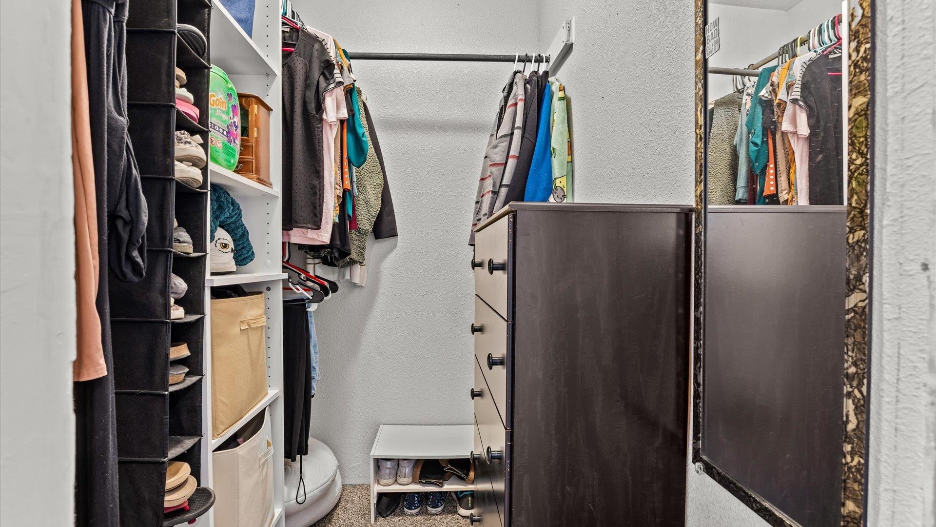2896 Seely Road Grand Junction, CO 81503 - Photo 14 of 27 a view of walk in closet with clothes and shoes