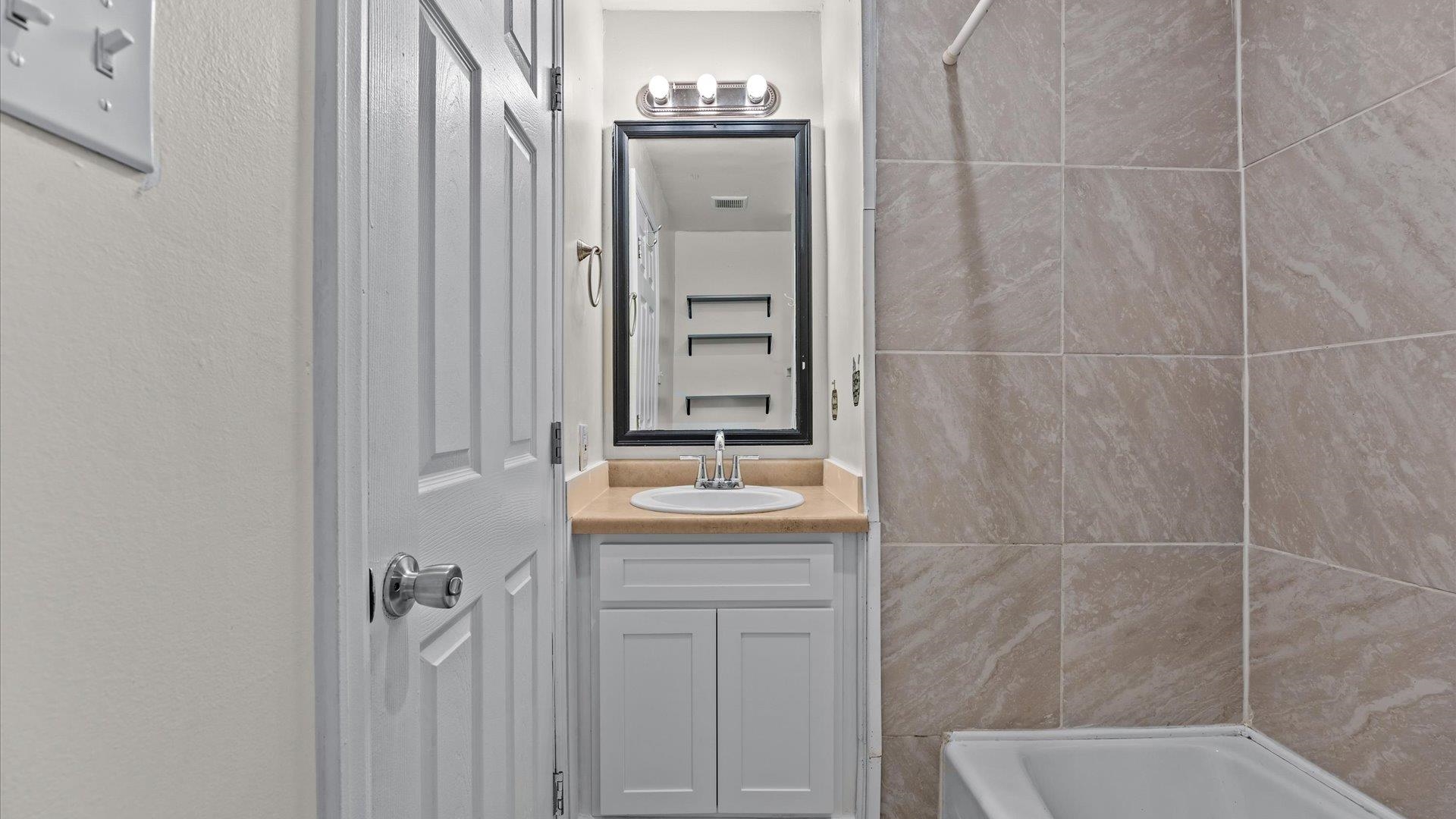 2896 Seely Road Grand Junction, CO 81503 - Photo 18 of 27 a bathroom with a granite countertop sink toilet and shower