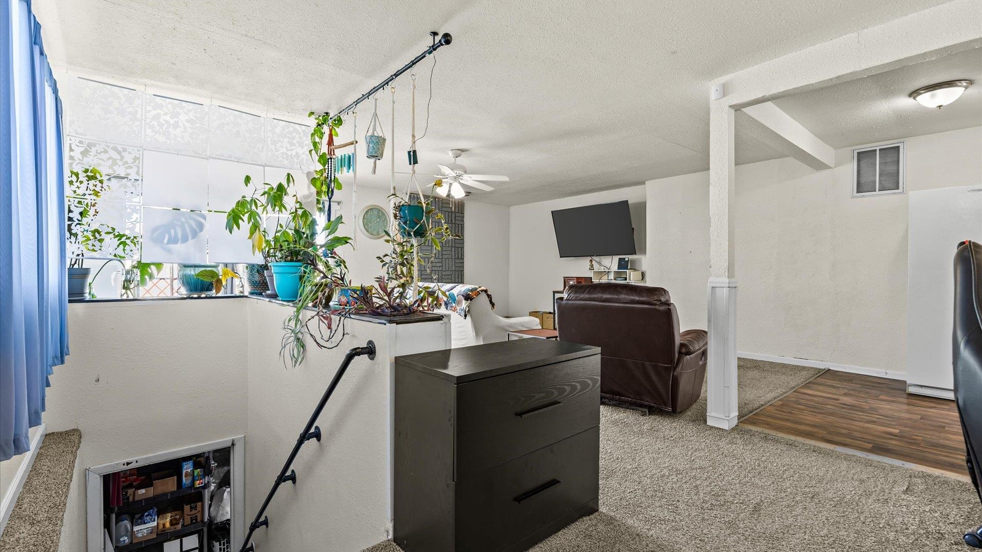 2896 Seely Road Grand Junction, CO 81503 - Photo 21 of 27 a view of a workspace with furniture and a potted plant