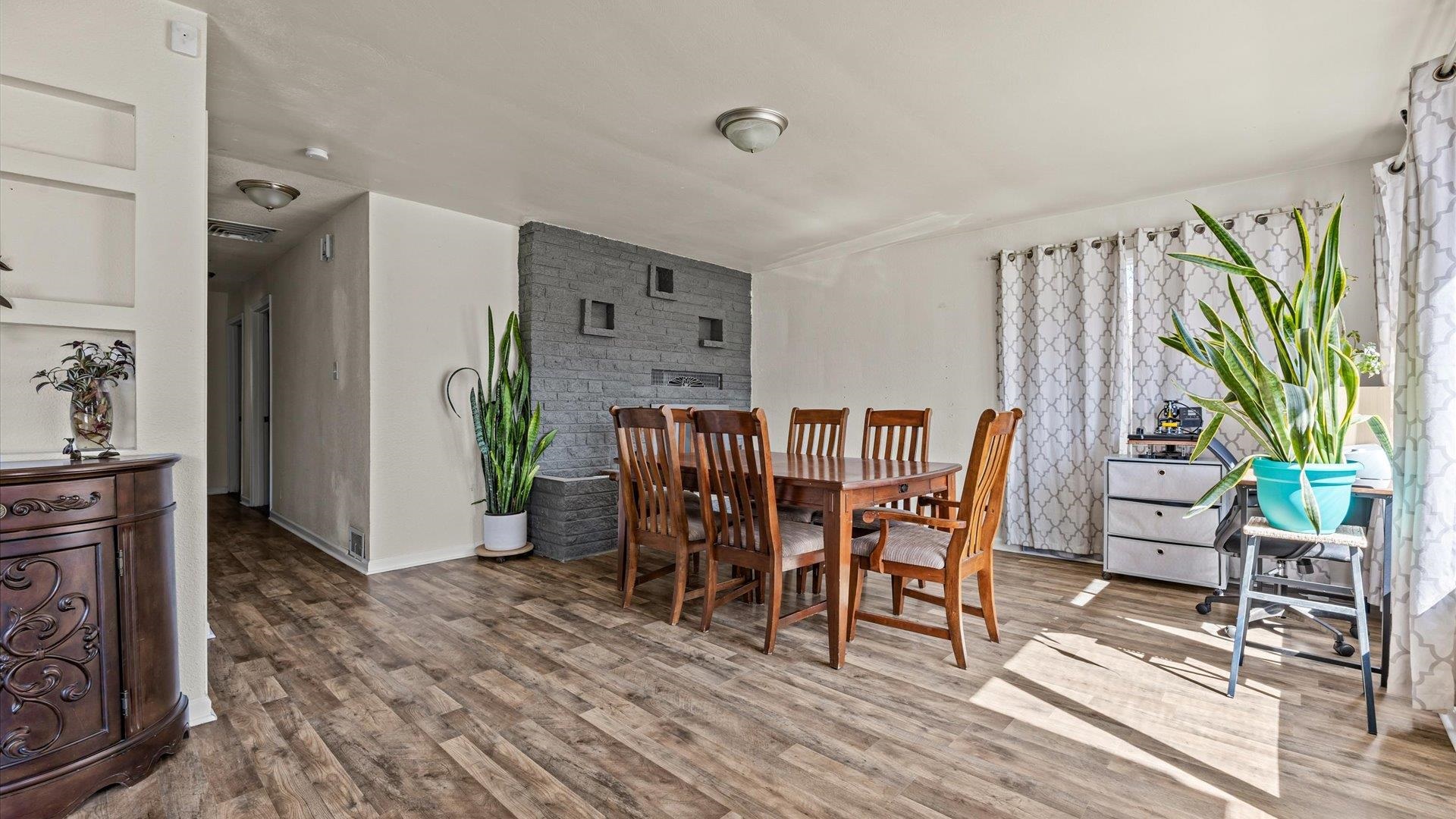 2896 Seely Road Grand Junction, CO 81503 - Photo 4 of 27 a dining room with furniture and wooden floor