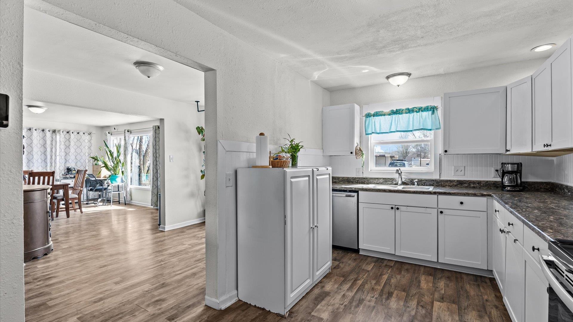 2896 Seely Road Grand Junction, CO 81503 - Photo 9 of 27 a kitchen with appliances cabinets a sink and a counter top space