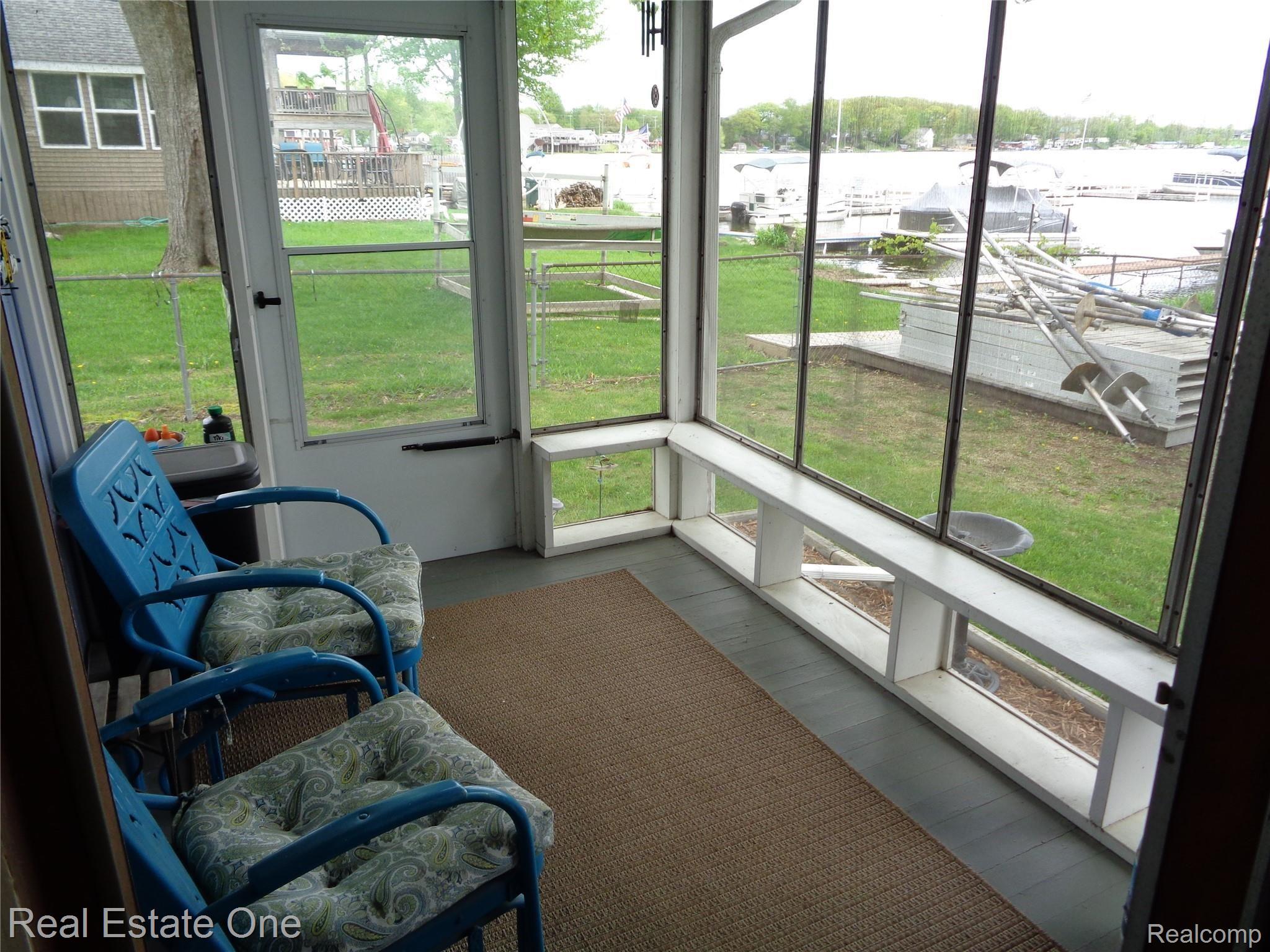 3865 Hunt Road Lapeer, MI 48446 - Photo 38 of 53 Enclosed patio (3-seasons). Note, patio deck currently has the dock parts on it which you see to the right. Dock company is coming out this week to install (delayed due to weather)