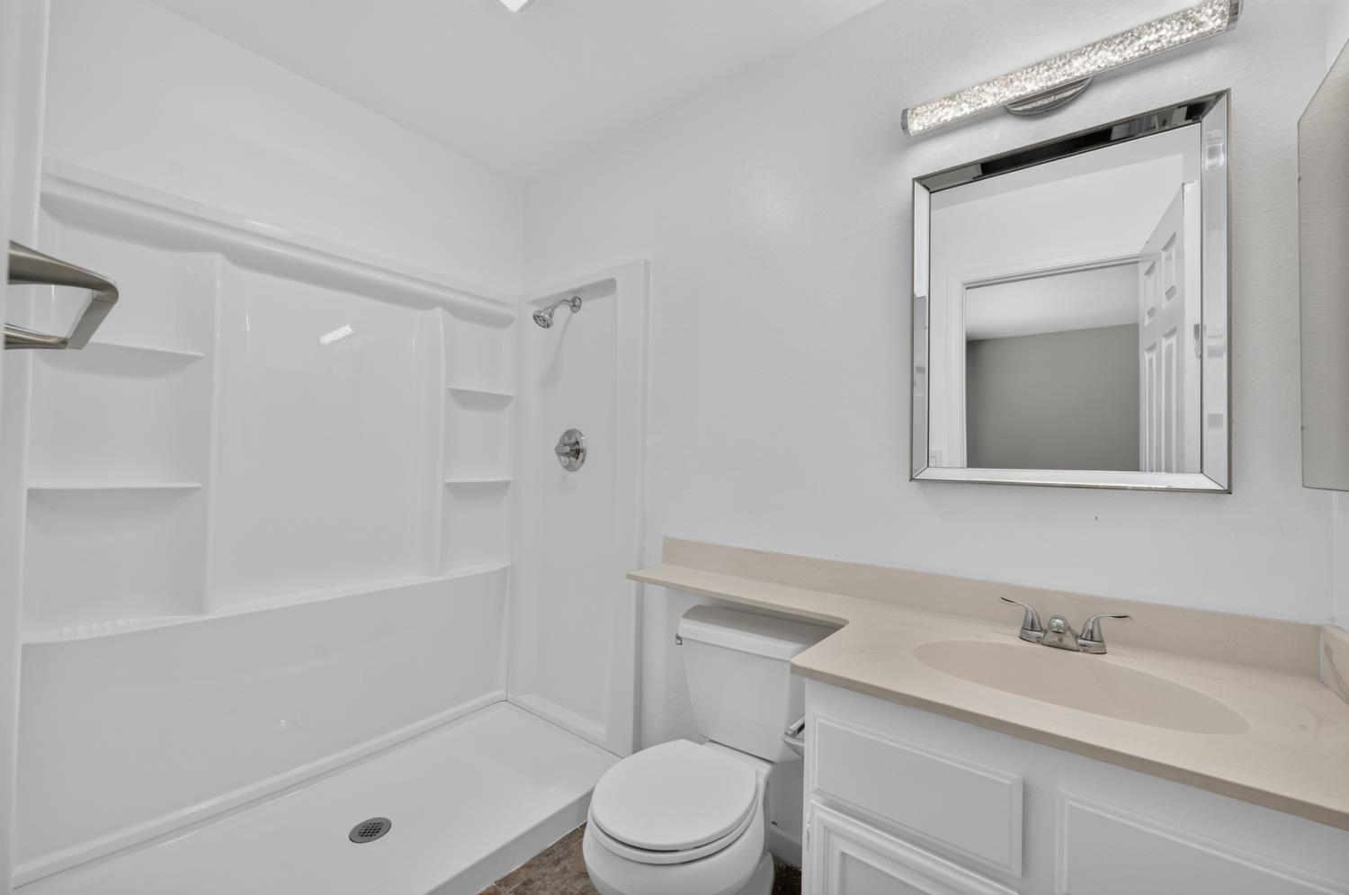 8488 Old Ranch Road Orangevale, CA 95662 - Photo 36 of 51 a bathroom with a sink a toilet and shower