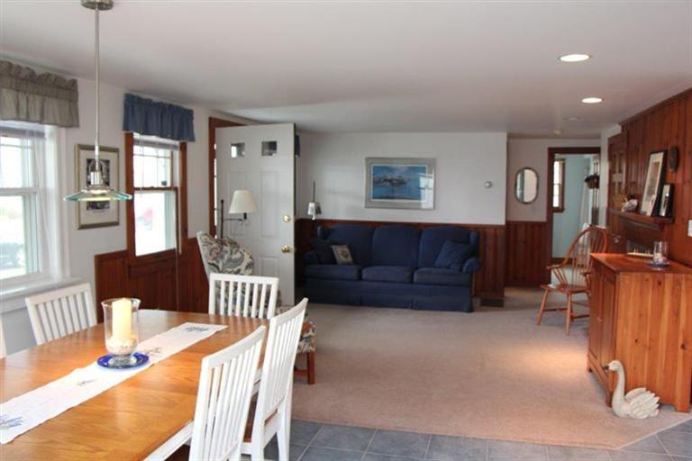 137 Leeward Road Bourne, MA 02532 - Photo 11 of 31 a living room with furniture a piano and a window
