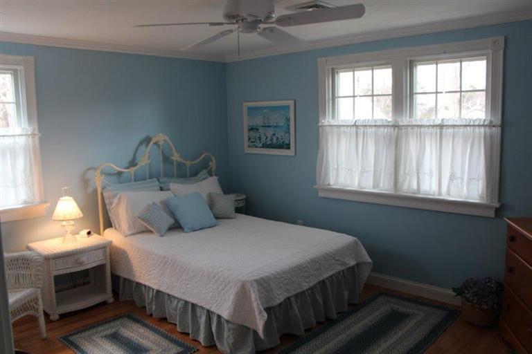 137 Leeward Road Bourne, MA 02532 - Photo 24 of 31 a bedroom with a bed and windows