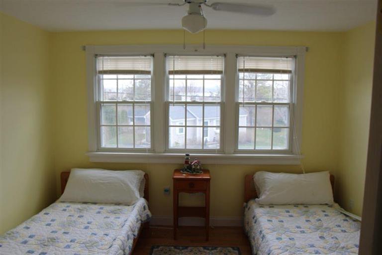 137 Leeward Road Bourne, MA 02532 - Photo 26 of 31 a bedroom with a bed and a table