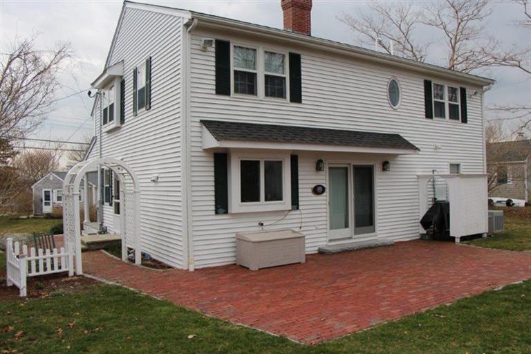 137 Leeward Road Bourne, MA 02532 - Photo 8 of 31 a view of house with backyard and a tree